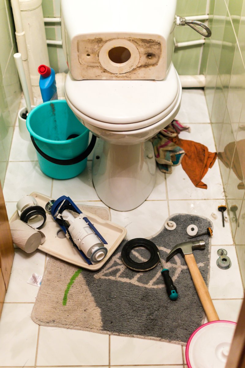 New toilet being installed in a Dulwich bathroom